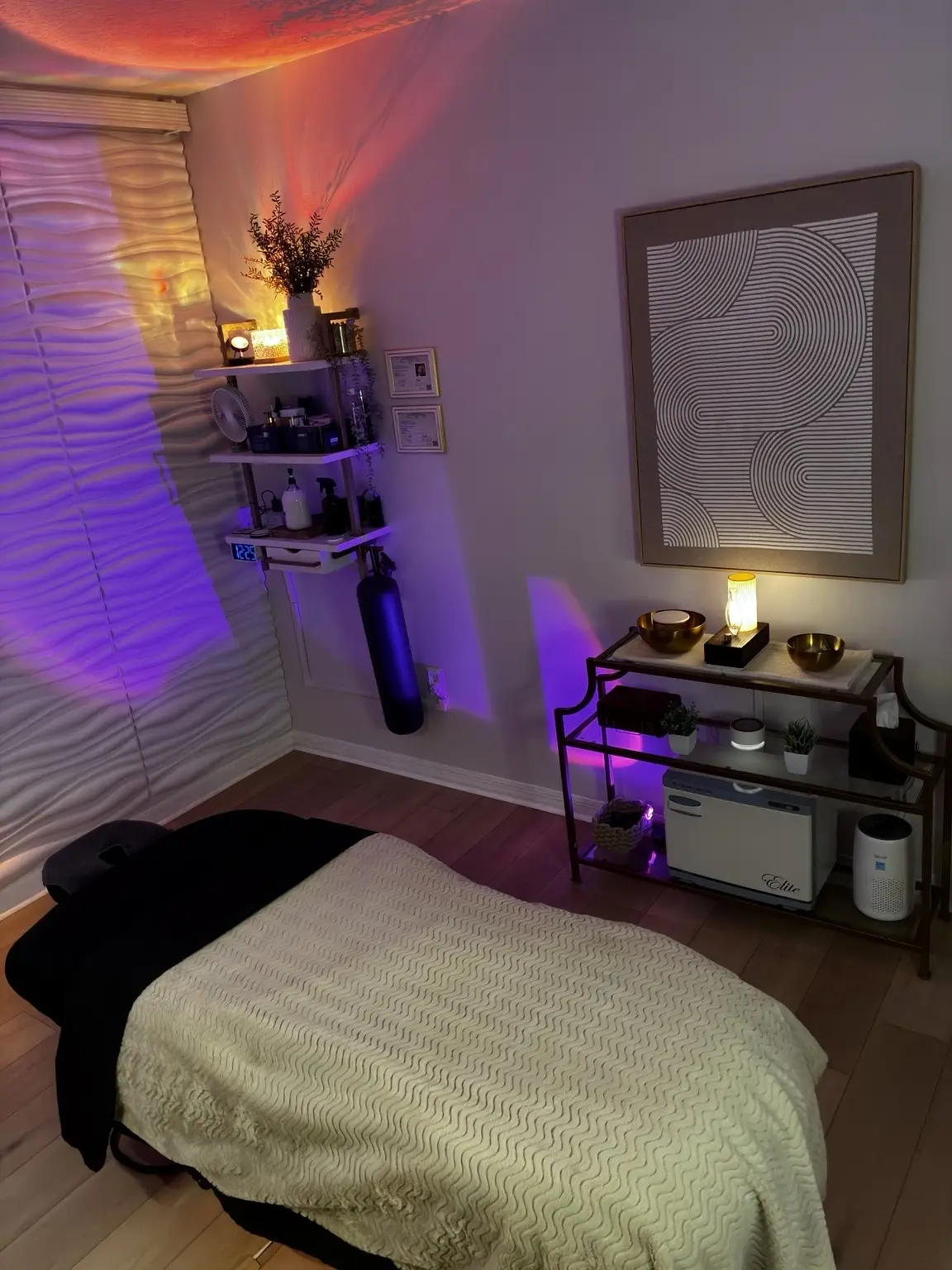 Massage table and warm spa atmosphere at The Reset Room in Melbourne, Florida